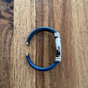 Geneva cuff blue leather watch with pearl face.